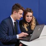 Two students working on laptops