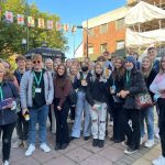 Alfie stood with group of friends