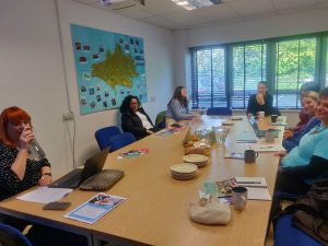 Students at the Dorset Mind industry day sat around a table