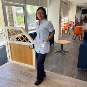 Nasha is smiling, wearing her skills uniform