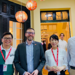 Chizuru Tanaka standing with 3 colleagues